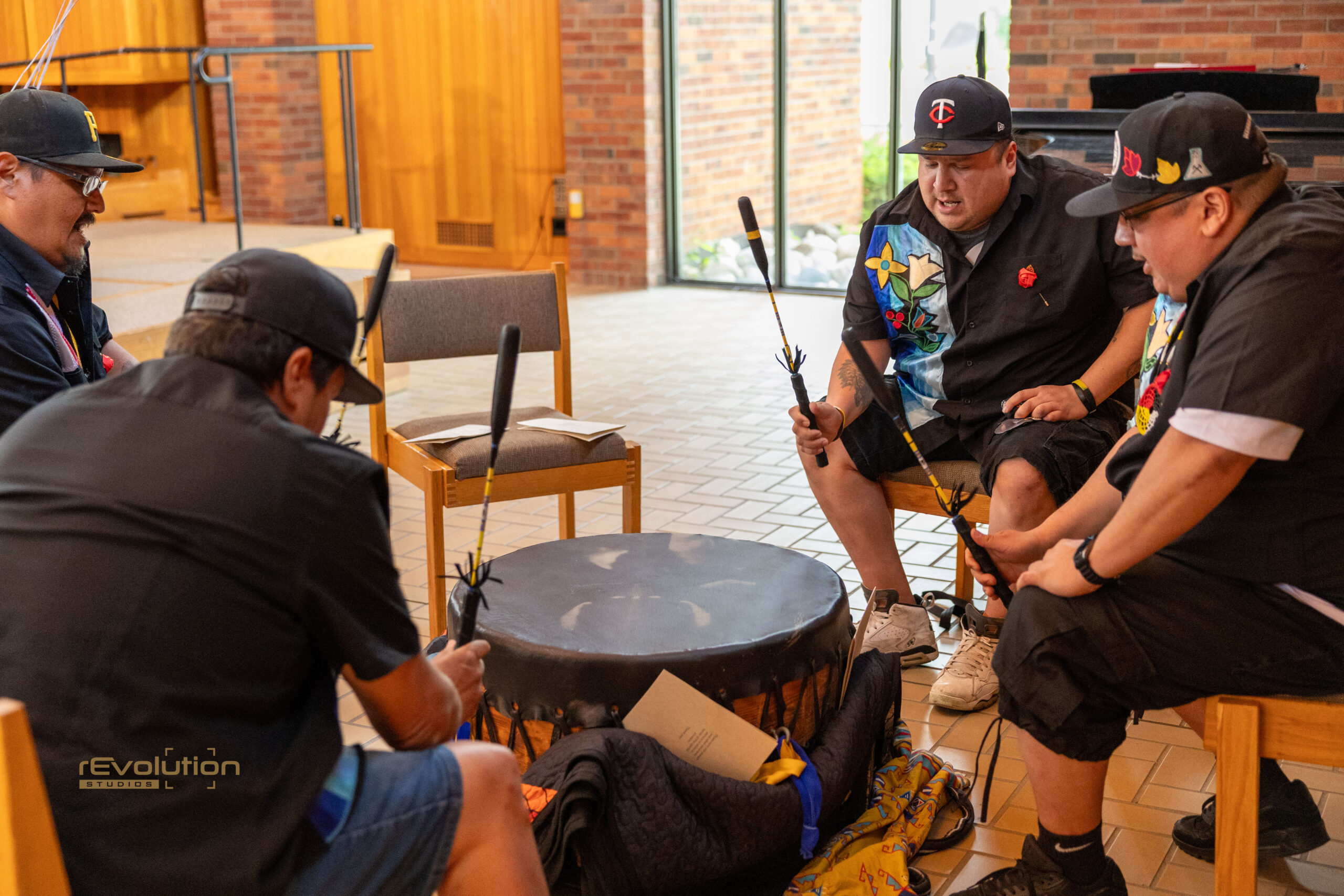 Native drum group performing together at an AFA graduation ceremony